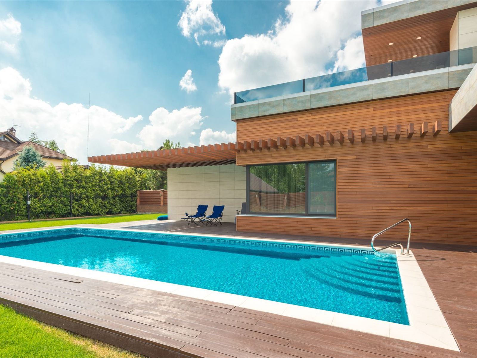 Home with timber deck and swimming pool